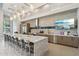 Elegant kitchen with a long island, modern appliances, and flat screen TV at 5250 E Deer Valley Dr # 247, Phoenix, AZ 85054