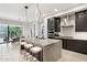 Open kitchen with a large island and modern pendant lighting, perfect for entertaining at 5250 E Deer Valley Dr # 247, Phoenix, AZ 85054