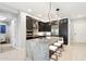 Modern kitchen with a large center island, pendant lighting, and stainless steel appliances at 5250 E Deer Valley Dr # 247, Phoenix, AZ 85054