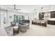 Open concept living area flows from the kitchen with designer furnishings and bright light at 5250 E Deer Valley Dr # 247, Phoenix, AZ 85054