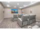 Home theater with comfortable recliner seating and a large screen for entertainment at 5250 E Deer Valley Dr # 247, Phoenix, AZ 85054