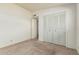 Bedroom with a closet with louvered doors and carpeted floors at 5420 N Granite Reef Rd, Scottsdale, AZ 85250