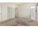Bedroom featuring carpeted floors and a closet with louvered doors at 5420 N Granite Reef Rd, Scottsdale, AZ 85250