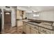 Kitchen with granite countertops, wooden cabinets, and a decorative wine rack at 5420 N Granite Reef Rd, Scottsdale, AZ 85250