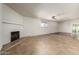 Spacious living room featuring a fireplace and tile floors at 5420 N Granite Reef Rd, Scottsdale, AZ 85250