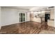 Living area with wood floors open to kitchen with breakfast bar at 5420 N Granite Reef Rd, Scottsdale, AZ 85250