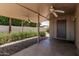 Inviting covered patio with ceiling fans, brick walkway, and lush greenery for outdoor relaxation and entertaining at 5420 N Granite Reef Rd, Scottsdale, AZ 85250