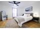 Bright bedroom features a comfortable bed, stylish gray headboard, and plenty of natural light from the large window at 6835 E Friess Dr, Scottsdale, AZ 85254