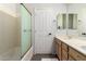 Bathroom with double sink, white cabinets and shower stall at 6862 W Honeysuckle Dr, Peoria, AZ 85383