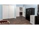 Bedroom with closet, safe and hardwood floors at 6862 W Honeysuckle Dr, Peoria, AZ 85383