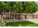 Charming two-story home with a well-manicured lawn, mature tree and a three car garage at 6862 W Honeysuckle Dr, Peoria, AZ 85383