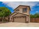 Charming two-story home with a well-manicured lawn and a two car garage at 6862 W Honeysuckle Dr, Peoria, AZ 85383