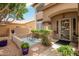 Inviting front porch with seating and a decorative security door at 6862 W Honeysuckle Dr, Peoria, AZ 85383