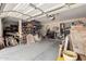 A spacious garage with abundant storage shelves, tools, and various household items at 6862 W Honeysuckle Dr, Peoria, AZ 85383