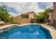 Sparkling pool with lush landscaping and lounge area, perfect for outdoor relaxation and entertaining in a private backyard setting at 6862 W Honeysuckle Dr, Peoria, AZ 85383