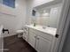 Bathroom featuring single sink vanity, dark hardware, tile floors, and toilet at 6947 W Spur Dr, Peoria, AZ 85383