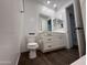Bathroom featuring toilet, vanity, mirror and tile flooring at 6947 W Spur Dr, Peoria, AZ 85383