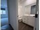 Bathroom featuring shower-tub combo, vanity, mirror, and tile flooring at 6947 W Spur Dr, Peoria, AZ 85383