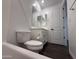 Bathroom featuring tile flooring, toilet, vanity with a white countertop, and mirror at 6947 W Spur Dr, Peoria, AZ 85383