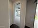 Bright bedroom with view of backyard through doorway and modern ceiling fan at 6947 W Spur Dr, Peoria, AZ 85383