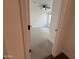 Bright bedroom view from doorway with ceiling fan, plush carpet, and natural light at 6947 W Spur Dr, Peoria, AZ 85383