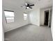 This bedroom features neutral walls, carpet, and a ceiling fan at 6947 W Spur Dr, Peoria, AZ 85383