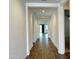 Bright hallway showcases hardwood floors and recessed lighting, offering a welcoming transition at 6947 W Spur Dr, Peoria, AZ 85383