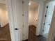 Hallway with wood-look tile leading to a laundry room at 6947 W Spur Dr, Peoria, AZ 85383