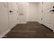 Hallway with wood-look tile flooring and white trim at 6947 W Spur Dr, Peoria, AZ 85383
