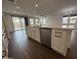 Kitchen island overlooking the dining room and backyard, featuring modern cabinets at 6947 W Spur Dr, Peoria, AZ 85383