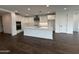 Bright, white kitchen showcasing a large island, modern appliances, and stylish finishes at 6947 W Spur Dr, Peoria, AZ 85383