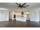 Spacious living area showcases hardwood floors, a modern ceiling fan, and a gourmet kitchen at 6947 W Spur Dr, Peoria, AZ 85383