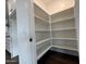 Spacious pantry offers plenty of shelving, complementing the kitchen's functionality at 6947 W Spur Dr, Peoria, AZ 85383