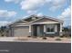 Beautiful single story home featuring neutral color palette, two car garage, and low maintenance desert landscaping at 7596 W Saddlehorn Rd, Peoria, AZ 85383