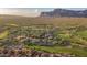 Expansive aerial view of luxury homes nestled along a scenic golf course with desert landscape at 7710 E Golden Eagle Cir, Gold Canyon, AZ 85118