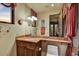 Bathroom showcasing a sink with granite counter tops, lots of lighting, toilet and decorative wall art at 7710 E Golden Eagle Cir, Gold Canyon, AZ 85118