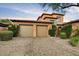 Charming two-story home with a two-car garage, stone accents, and lush landscaping at 7710 E Golden Eagle Cir, Gold Canyon, AZ 85118