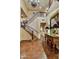 Stunning foyer with a staircase, custom iron railing, and elegant tile flooring at 7710 E Golden Eagle Cir, Gold Canyon, AZ 85118