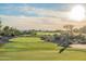 Expansive golf course with mountain views and lush greenery on a sunny day at 7710 E Golden Eagle Cir, Gold Canyon, AZ 85118