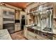 Gourmet kitchen with stainless steel appliances, custom cabinetry, and a professional range at 7710 E Golden Eagle Cir, Gold Canyon, AZ 85118