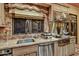 View of the kitchen features stainless steel appliances, a granite countertop, and mosaic tile backsplash at 7710 E Golden Eagle Cir, Gold Canyon, AZ 85118