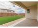 Artificial grass backyard with covered patio at 8817 W Denton Ln, Glendale, AZ 85305