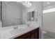 Well-lit bathroom with double sinks and a framed mirror at 8817 W Denton Ln, Glendale, AZ 85305