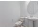 Powder room featuring a pedestal sink and neutral wall paint at 8817 W Denton Ln, Glendale, AZ 85305