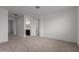 An airy bedroom with soft carpet is connected to a full bathroom at 8817 W Denton Ln, Glendale, AZ 85305
