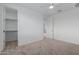 Bright bedroom with an attached closet and a ceiling fan at 8817 W Denton Ln, Glendale, AZ 85305