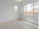 Dining room featuring modern chandelier fixture and views of the community at 8817 W Denton Ln, Glendale, AZ 85305