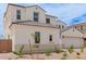 Lovely home featuring neutral colors, a two-car garage, and desert landscaping at 8817 W Denton Ln, Glendale, AZ 85305
