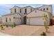 Stunning two-story house with a beautiful entrance and a spacious three-car garage at 8817 W Denton Ln, Glendale, AZ 85305