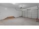 Spacious garage with ample storage and an automatic garage door at 8817 W Denton Ln, Glendale, AZ 85305